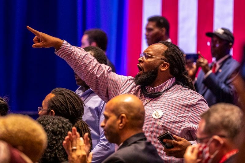 09/25/2020 - Atlanta, Georgia - A President Trump supporter shouts in agreement to remarks made by the President during a Blacks for Trump campaign rally at the Cobb Galleria Centre in Atlanta, Friday, September 25, 2020.  (Alyssa Pointer / Alyssa.Pointer@ajc.com)