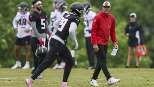 Atlanta Falcons offensive coordinator Zac Robinson, right, watches as wide receiver Chris Blair goes through a drill during minicamp at the Atlanta Falcons Training Camp, Tuesday, May 14, 2024, in Flowery Branch, Ga. (Jason Getz / AJC)
