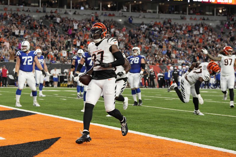 Cincinnati Bengals safety Jordan Battle (27) returns an interception for a touchdown during the first half of a preseason NFL football game against the Indianapolis Colts, Thursday, Aug. 22, 2024, in Cincinnati. (AP Photo/Jeff Dean)