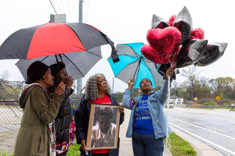 (L-R) Patricia Scott, Kimberly Handy-Jones, Kathy Scott-Lykes, and Dalphine Robinson hold a balloon release ceremony for Scott-Lykes son, Jarvis Lykes, in Atlanta on Friday, March 15, 2024. Arvin Temkar / arvin.temkar@ajc.com)