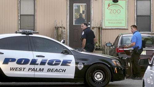 Police officers enter the administration building at the Palm Beach Zoo after a zookeeper was said to have been mauled to death by a tiger Friday afternoon, April 15, 2016 at the Zoo. It took 17 minutes for rescue personnel to reach zookeeper Stacey Konwiser, who had been fatally mauled. (Damon Higgins / The Palm Beach Post)