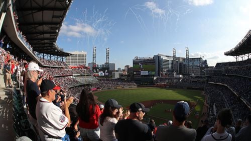 Fans  cheer before the start of a playoff game at SunTrust Park.
