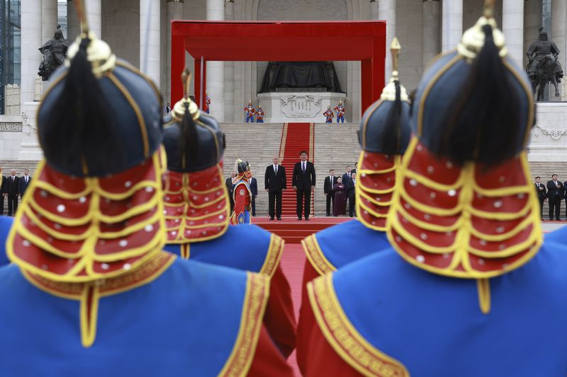 Russian President Vladimir Putin, centre left, and Mongolian President Ukhnaagiin Khurelsukh attend a welcome ceremony in Sukhbaatar Square in Ulaanbaatar, Mongolia, Tuesday, Sept. 3, 2024. (Vyacheslav Prokofyev, Sputnik, Kremlin Pool Photo via AP)