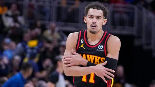 Atlanta Hawks' Trae Young reacts after hitting a shot against the Indiana Pacers during the second half of an NBA basketball game Friday, Jan. 13, 2023, in Indianapolis. (AP Photo/Darron Cummings)