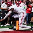 Alabama's Jalen Milroe (4) runs for a touchdown during the first half of an NCAA college football game against Wisconsin Saturday, Sept. 14, 2024, in Madison, Wis. (AP Photo/Morry Gash)