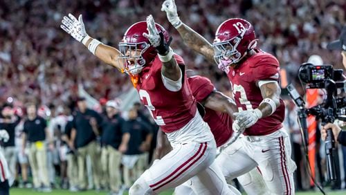 Alabama defensive back Zabien Brown (2) celebrates his game-clinching interception with Alabama defensive back Malachi Moore (13) during the second half of an NCAA college football game against Georgia, Saturday, Sept. 28, 2024, in Tuscaloosa, Ala. (AP Photo/Vasha Hunt)