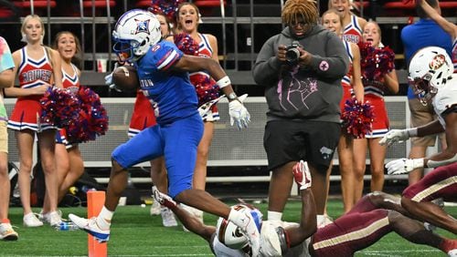 August 20 , 2022 Atlanta - Walton's Ayden Jackson (5) scores a touchdown pass over Mill Creek's Caleb Downs (2) during the 2022 Corky Kell Classic at Mercedes Benz Stadium on Saturday, August 20, 2022. Mill Creek won 44-41 over Walton. (Hyosub Shin / Hyosub.Shin@ajc.com)