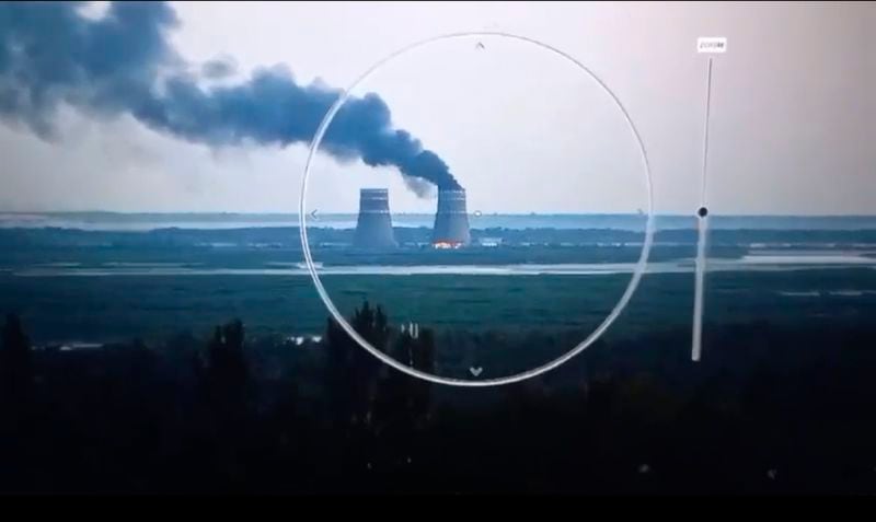 In this image from a surveillance camera provided by the Ukrainian Presidential Press Office, smoke rises from a cooling tower of the Zaporizhzhia Nuclear Power Station in a Russia-controlled area in the Energodar, Zaporizhzhia region of Ukraine, Sunday, Aug. 11, 2024. (Ukrainian Presidential Press Office via AP)