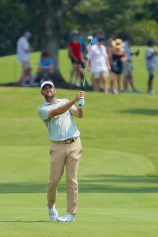 Scottie Scheffler hits his second shot on the fifth fairway during the final round of the Tour Championship at East Lake Golf Club, Sunday, Sept. 1, 2024, in Atlanta.
(Miguel Martinez / AJC)