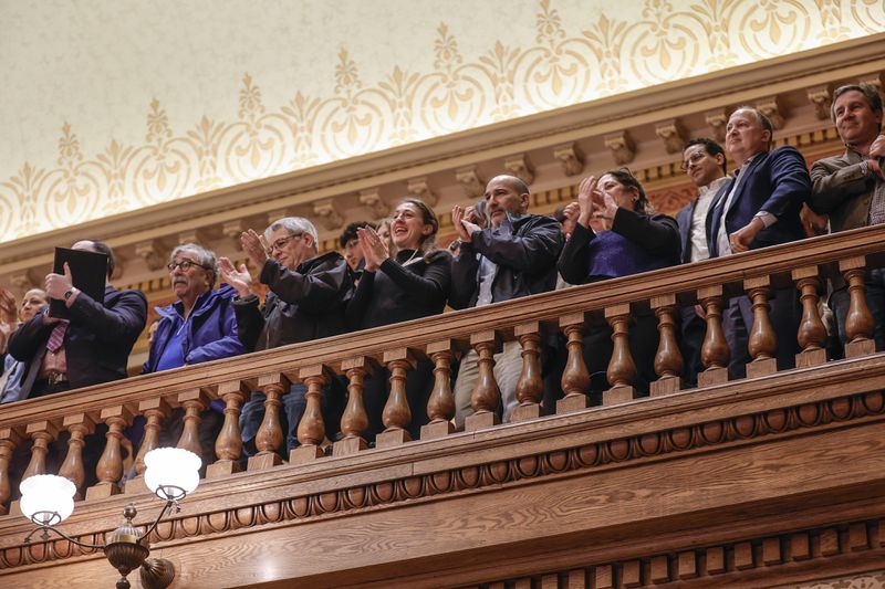 Members of the Jewish community clap after the passage of the antisemitism bill in the state Senate on Thursday. (Natrice Miller/Natrice.miller@ajc.com)
