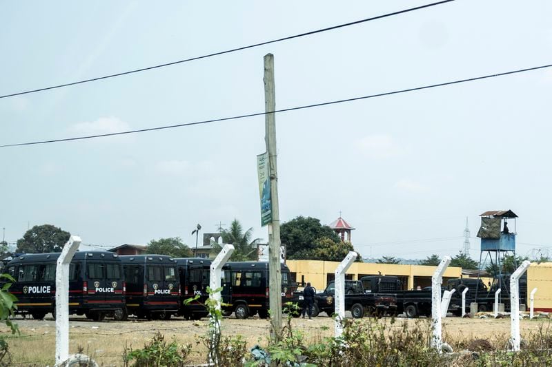 Police vehicles are seen outside the Makala Central prison in Kinshasa, Congo, Tuesday, Sept. 3, 2024 after an attempted jailbreak in Congo’s main prison that left many people dead. (AP Photo/Samy Ntumba Shambuyi)