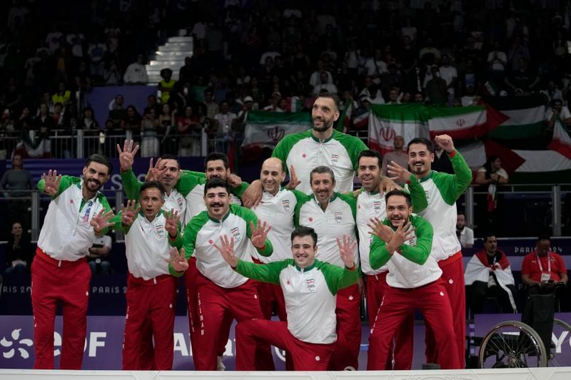 Iran players celebrate after winning the men's Sitting Volleyball Gold Medal Match against Bosnia and Herzegovina, at the 2024 Paralympics, Friday, Sept. 6, 2024, in Paris, France. (AP Photo/Christophe Ena)