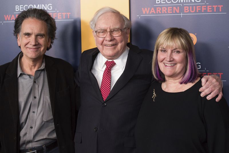 FILE - Peter Buffett, left, Warren Buffett, center, and Susie Buffett attend the world premiere screening of HBO's "Becoming Warren Buffett" at The Museum of Modern Art on Jan. 19, 2017 in New York. (Photo by Charles Sykes/Invision/AP, File)