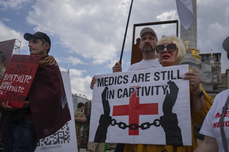 Activists and relatives hold a rally demanding the release of Ukrainian soldiers who were captured by Russia during the war, in the Independence square in Kyiv, Ukraine, Thursday, May 23, 2024. (AP Photo/Efrem Lukatsky)
