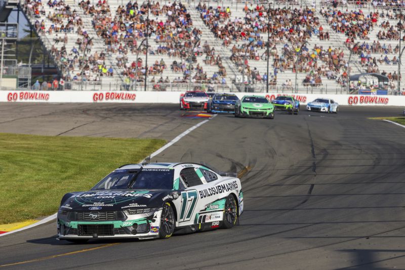 Chris Buescher (17) competes in a NASCAR Cup Series auto race, Sunday, Sept. 15, 2024, in Watkins Glen, N.Y. (AP Photo/Lauren Petracca)