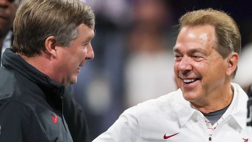 Georgia Bulldogs head coach Kirby Smart and Alabama Crimson Tide head coach Nick Saban get together before the SEC Championship football game at the Mercedes-Benz Stadium in Atlanta, on Saturday, December 2, 2023. (Jason Getz / Jason.Getz@ajc.com)