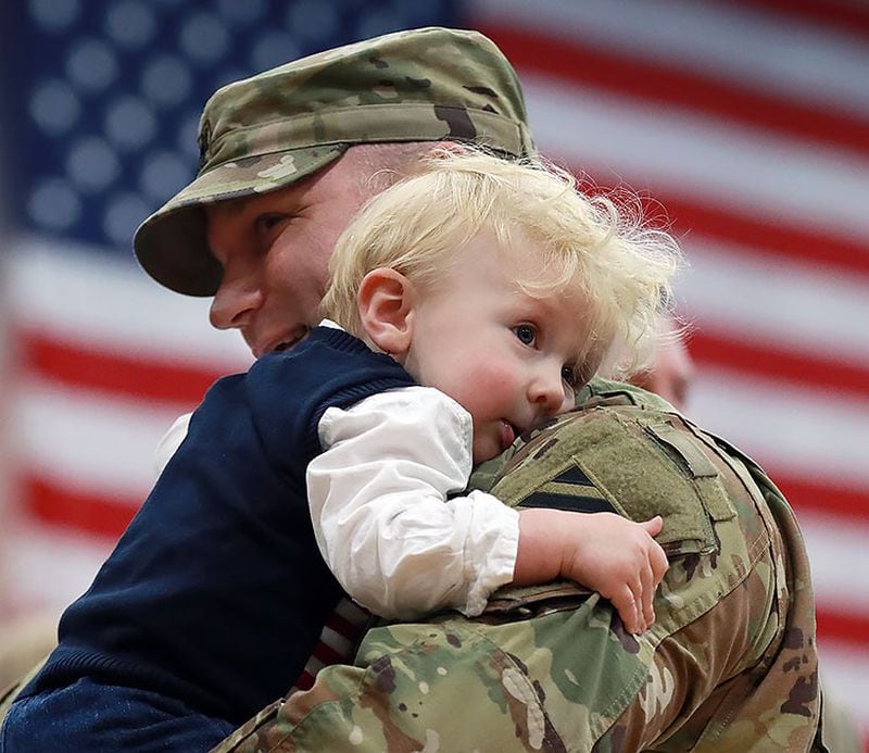 Fort Stewart: Lieutenant colonel Nate Stone hugs his 1-year-old son Conrad during the Georgia National Guardâ€™s 48th Brigade Combat Team Casing of Color and Departure Ceremony for their deployment to Afghanistan on Friday, Dec 21, 2018, at Fort Stewart.