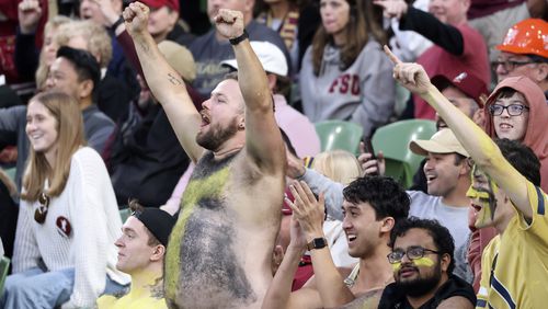 Fans cheer during the NCAA college football game between Georgia Tech and Florida State at the Aviva stadium in Dublin, Saturday, Aug. 24, 2024. (AP Photo/Peter Morrison)