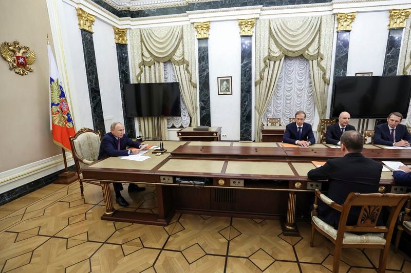 Russian President Vladimir Putin, left, speaks at the Security Council meeting on nuclear deterrence at the Kremlin in Moscow, Russia, Wednesday, Sept. 25, 2024. (Alexander Kazakov, Sputnik, Kremlin Pool Photo via AP)