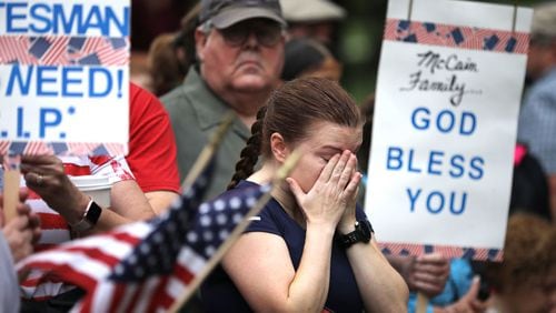 A woman wipes away tears after a Sept. 1, 2018, wreath-laying ceremony to honor the late Sen. John McCain, R-Ariz., at the Vietnam Veterans Memorial on the National Mall in Washington, D.C. (Chip Somodevilla/Getty Images)