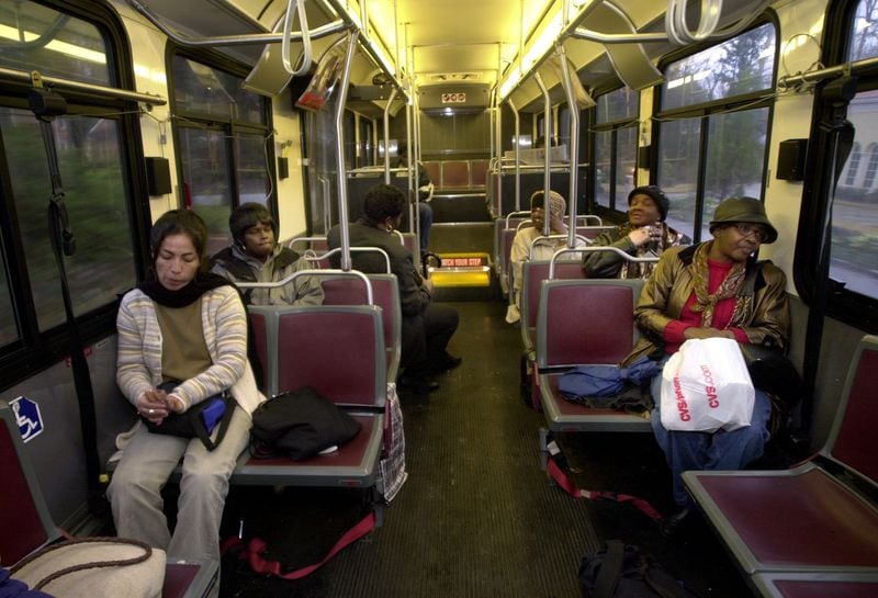 Atlanta maids leaving work ride MARTA bus route 706 from the Mt. Paran Rd. area to downtown Atlanta in 2001. (Charlotte B. Teagle/AJC 2001 photo)