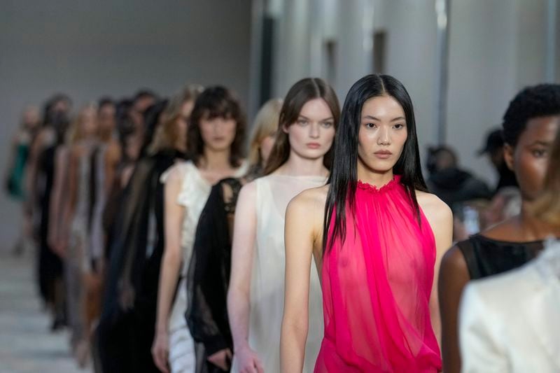 Models wear creations as part of the Alberta Ferretti Spring Summer 2025 collection, that was presented in Milan, Italy, Tuesday, Sept. 17, 2024. (AP Photo/Luca Bruno).