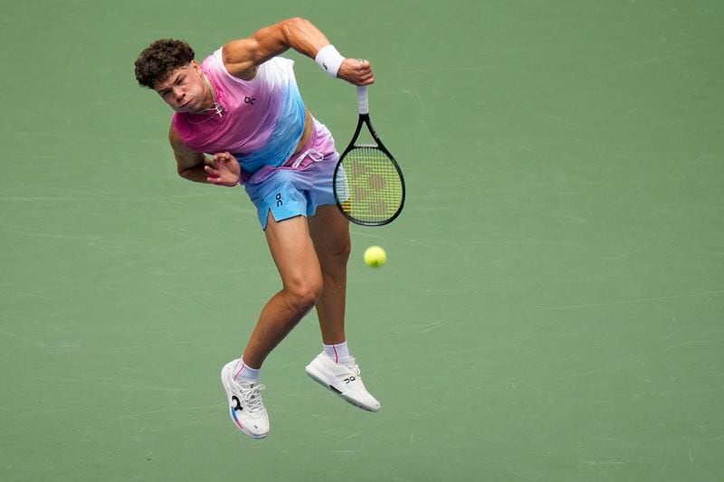 Ben Shelton, of the United States, serves to Frances Tiafoe, of the United States, during the third round of the U.S. Open tennis championships, Friday, Aug. 30, 2024, in New York. (AP Photo/Seth Wenig)