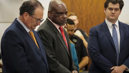 Retired Houston Police Department officer Gerald Goines, center, listens to the prosecutor reading his two felony murder charges in the January 2019 deaths of Dennis Tuttle and Rhogena Nicholas, Monday, Sept. 9, 2024, at Harris County Criminal Courthouse in Houston. (Yi-Chin Lee/Houston Chronicle via AP)