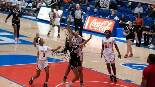 Jackson's British McKinney attempts to block a shot during at the GHSA AAAAA girls Kell vs Jackson basketball semifinals playoff game at West Georgia College on March 3, 2023. Jamie Spaar for the Atlanta Journal-Constitution