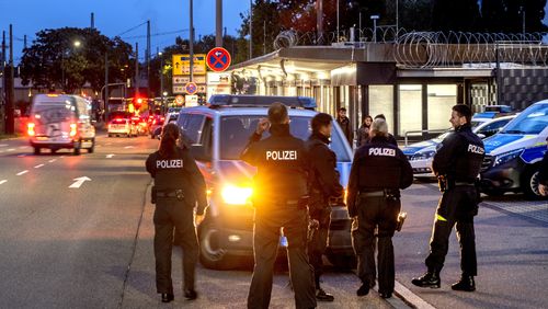 German police officers stand at the border between Germany and France in Kohl, Germany, Monday, Sept. 16, 2024 as Germany controls all his borders from Monday on. (AP Photo/Michael Probst)