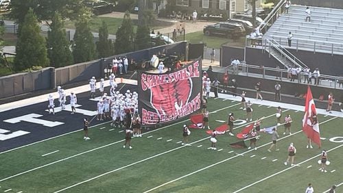 Gainesville players prepare to take the field before their season-opening game against Marietta at Northcutt Stadium on Aug. 16, 2024.