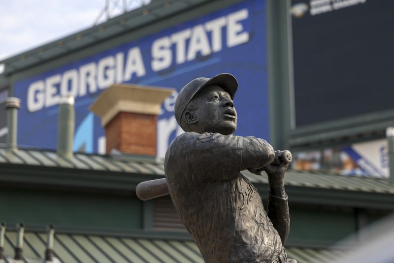 A statue marking Hank Aaron's 715th home run to break Babe Ruth's career record stands at Georgia State University's Center Parc Stadium, formerly Turner Field, where the Atlanta Braves played from 1997 to 2016. Another statue of Aaron could be placed in the National Statuary Hall at the U.S. Capitol if the General Assembly agrees. (Jason Getz / jason.getz@ajc.com)  