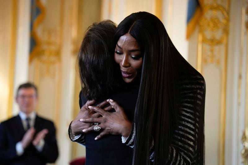 Naomi Campbell, right, greets French Culture Minister Rachida Dati after being awarded with the medal of "Chevalier de l'Ordres des Arts et des Lettres", at the Culture ministry, in Paris, Thursday, Sept. 26, 2024. (AP Photo/Louise Delmotte)