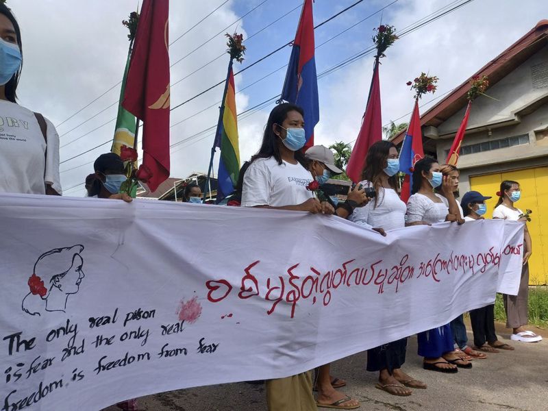 Demonstrators hold a banner with Aung San Suu Kyi's famous quote ''The only real prison is fear, and the only real freedom, is freedom from fear'', as they march during a rally to mark the 79th birthday of the country’s ousted leader Aung San Suu Kyi in Launglon township in Tanintharyi region, Myanmar, Wednesday, June 19, 2024. (Democracy Movement Strike Committee-Dawei via AP)