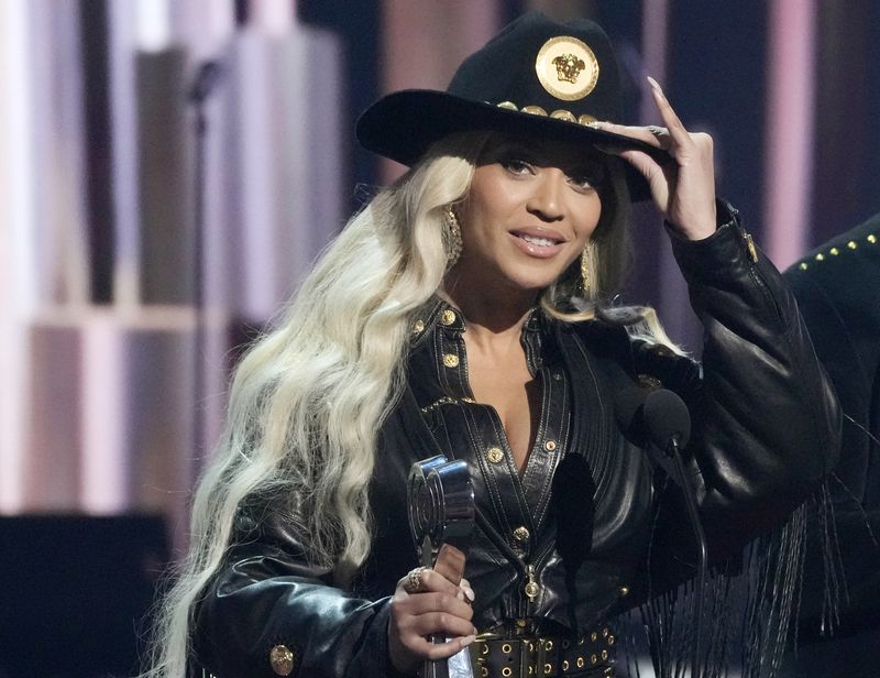 FILE - Beyonce, left, accepts the Innovator Award during the iHeartRadio Music Awards, April 1, 2024, at the Dolby Theatre in Los Angeles. (AP Photo/Chris Pizzello, file)