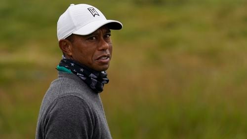 Tiger Woods is all bundled up for work on the practice putting green at TPC Harding Park in San Francisco, prior to the PGA Championship.