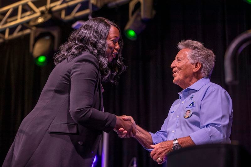 Gwinnett County Commissioners Chair Nicole Love Hendrickson speaks with Mario Andretti during the grand opening of the Andretti Indoor Karting & Games in Buford Wednesday, June 23, 2021. (Alyssa Pointer / Alyssa.Pointer@ajc.com)

