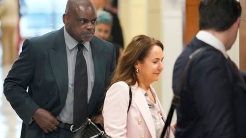 Former Houston police officer Gerald Goines, left, and his defense attorney Nicole DeBorde Hochglaube arrive to the 482nd District Court to await a verdict in his murder trial at the Harris County Criminal courthouse Wednesday, Sept. 25, 2024, in Houston. Goines faces two felony murder charges in the January 2019 deaths of Dennis Tuttle and Rhogena Nicholas. (Melissa Phillip/Houston Chronicle via AP)