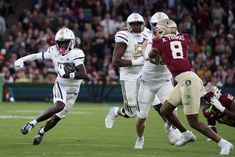 Georgia's Eric Singleton controls the ball during the NCAA college football game between Georgia Tech and Florida State at the Aviva stadium in Dublin, Saturday, Aug. 24, 2024. (AP Photo/Peter Morrison)