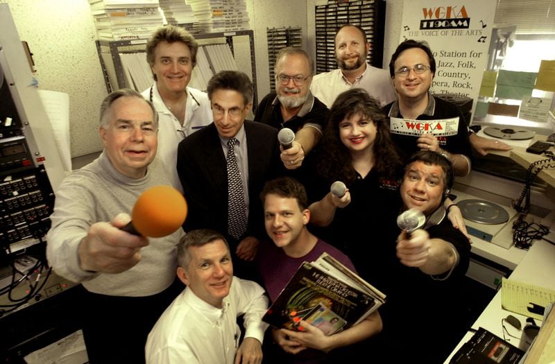 000309 ATLANTA,GA.: WGKA personalities pose for a group photo in one of the studios, clockwise starting with lower left hand corner are; Nick Jones (CQ), (white shirt), Don Kennedy (CQ)(holding orange microphone), Jason Byce (CQ), Joe Weber (CQ)(suit & tie), Lee Garen (CQ), Brian Arthur(Smith)(CQ)(beard), Mike Rose (CQ)(holding bumper sticker), Keely Brown (CQ)(only woman), Larry Larson and Denny Zartnan (CQ)(holding record albums). (JOEY IVANSCO/staff photo).
