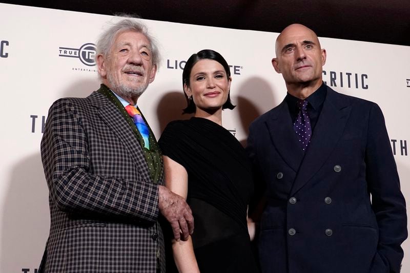 Ian McKellen, left, with Gemma Arterton, centre and Mark Stong as they pose for photographers upon arrival at the European Premiere of the The Critic, In London, Monday, Sept. 2, 2024. (AP Photo/Alberto Pezzali)