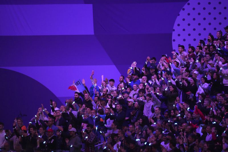 Spectators applaud during the closing ceremony of the 2024 Paralympics, Sunday, Sept. 8, 2024, in Paris, France. (AP Photo/Thibault Camus)