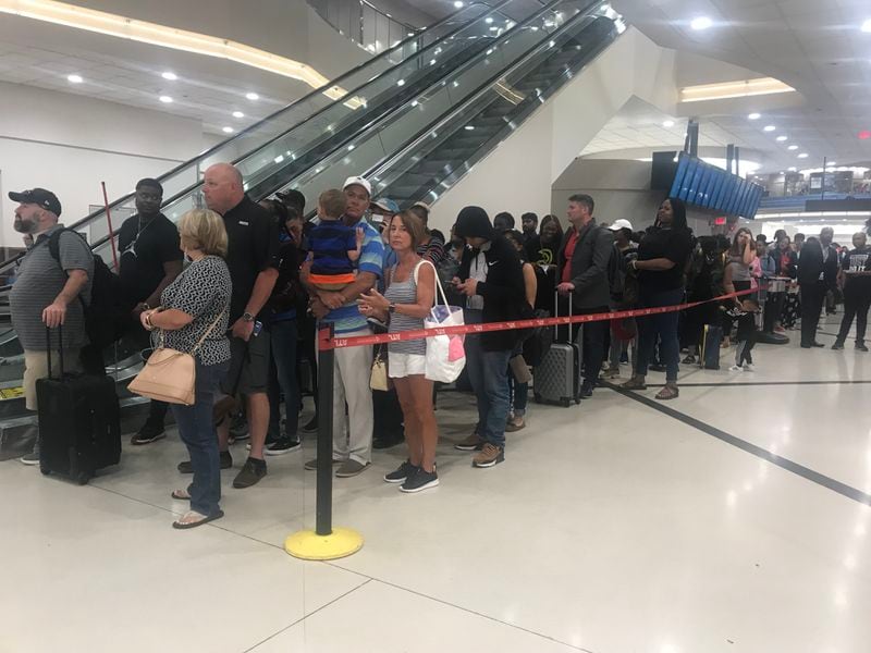 Long lines make it clear that Memorial Day weekend travel is in full swing at Hartsfield-Jackson International Airport on Friday morning, May 24, 2019 (Photo: Kelly Yamanouchi/AJC)
