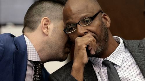 FILE - Christopher Dunn, right, listens to his attorney Justin Bonus from New York City during the first day of his hearing to decide whether to vacate his murder conviction, Tuesday, May 21, 2024, at the Carnahan Courthouse in St. Louis. A Missouri judge on Monday, July 24, 2024, overturned the conviction of Dunn, who has spent more than 30 years in prison for a killing he has long contended he didn’t commit. (Laurie Skrivan/St. Louis Post-Dispatch via AP, Pool, File)