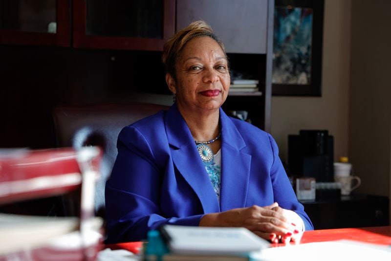 Henry County Chair Carlotta Harrell poses for a photo in her office at the Henry County Administration Building on Thursday, Dec. 14, 2023.  Henry County was home to 11 of the 20 hottest census tracts for bulk buyers in the metro area, the AJC’s analysis found. In January, the county imposed a one-year moratorium on most housing applications and implemented a cap preventing more than 5% of homes in new subdivisions from being rentals. (Natrice Miller/ Natrice.miller@ajc.com)