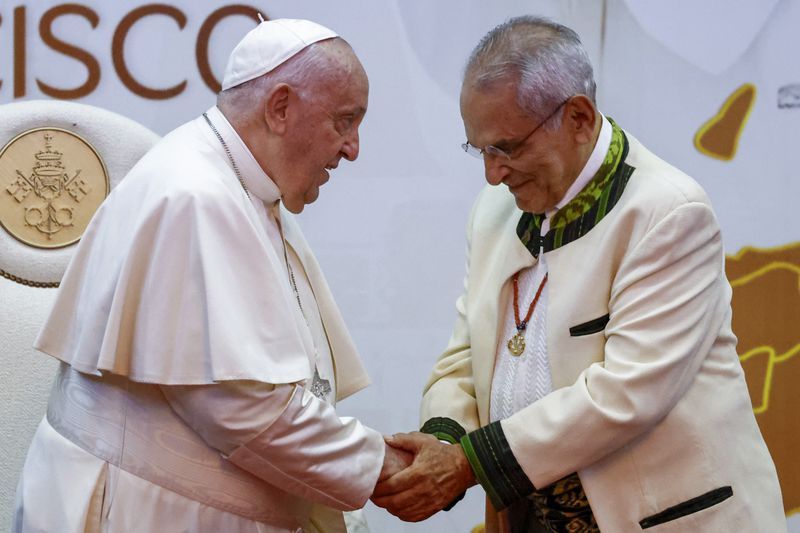 East Timor President Jose Ramos-Horta, right, shakes hands with Pope Francis during a meeting with East Timor authorities, civil society, and the diplomatic corps at the Presidential Palace in Dili, East Timor, Monday, Sept. 9, 2024. (Willy Kurniawan/Pool Photo via AP)