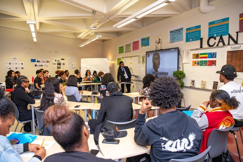 Rashad Brown teaches Advanced Placement African American Studies at Maynard Jackson High School on Friday, Feb 17, 2023. Students participate in dialogue and debate, present projects and consider why restrictions are being put on the course in other states. (Jenni Girtman for The Atlanta Journal-Constitution)