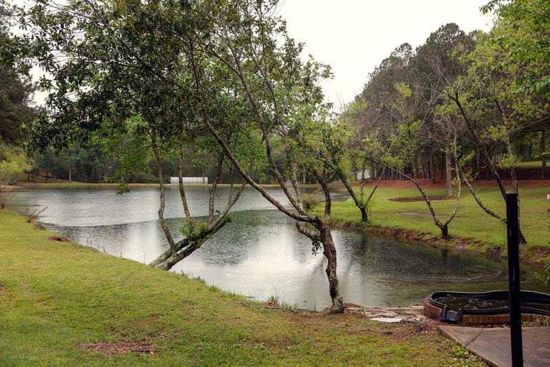 Views of Lake Sheryl located on the Livsey family property in Snellville shown on Friday, April 14, 2023. The Livsey family says that Gwinnett County is attempting to acquire 10 acres of the land through eminent domain. (Natrice Miller/ natrice.miller@ajc.com)