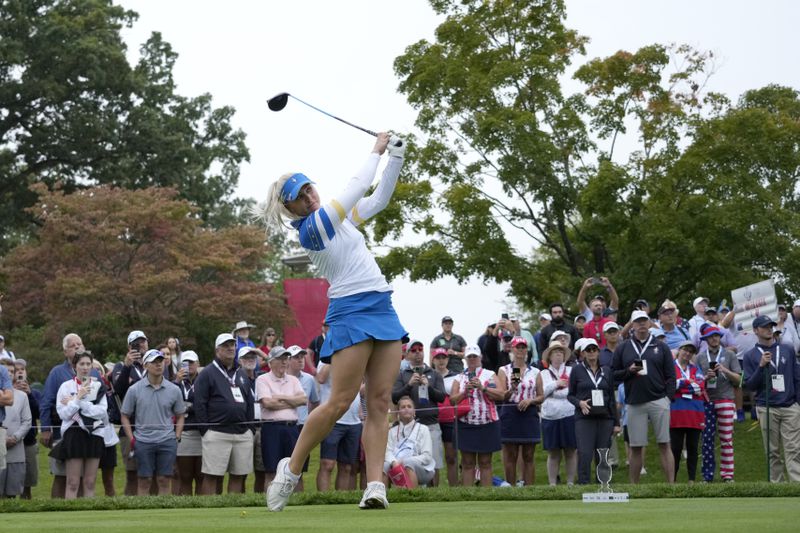 Europe's Charley Hull hits from the eighth tee during a Solheim Cup golf tournament foursomes match at Robert Trent Jones Golf Club, Friday, Sept. 13, 2024, in Gainesville, VA. (AP Photo/Matt York)