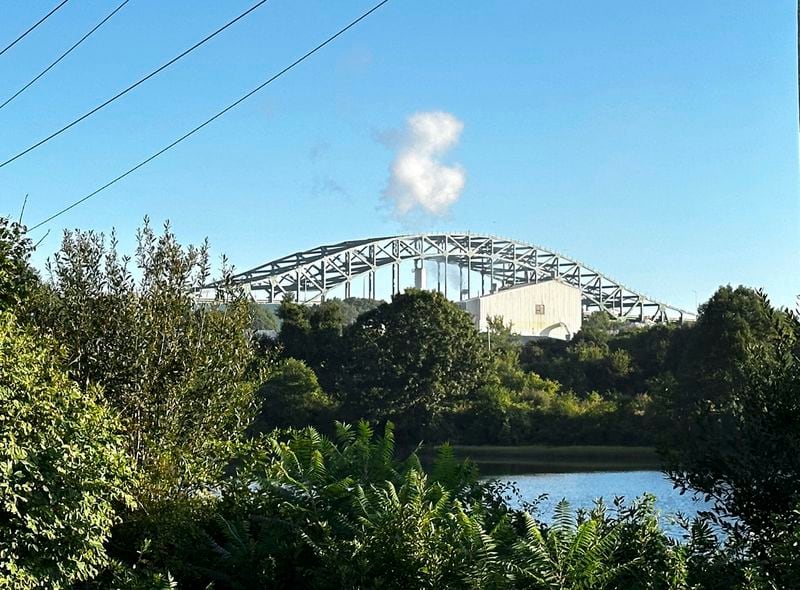 The Piscataqua River Bridge is shown in Portsmouth, N.H. after a man connected to a homicide was fatally shot by police and an 8-year-old child was found shot to death in the man’s car on the bridge that connects New Hampshire to Maine, Thursday, Aug. 29, 2024. An 8-year-old child was found shot to death in the man's car, the attorney general's office said Thursday. (AP Photo/Caleb Jones)